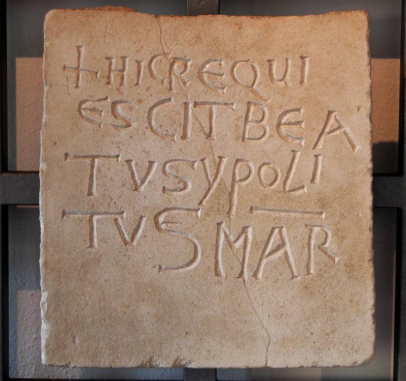 Latin inscription displayed in the Antiquarium of the basilica, mentioning the tomb of Ippolito